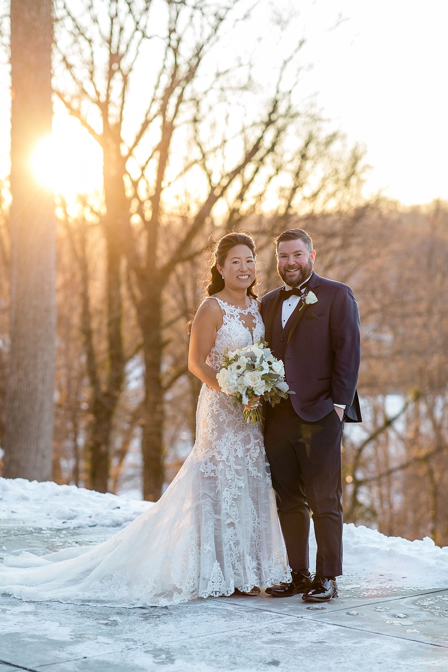 newlyweds in golden hour in snow by Jen Harvey Photography