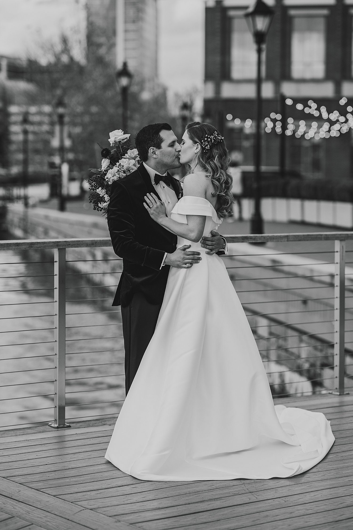 man and woman share a kiss before their ceremony at The Belvedere