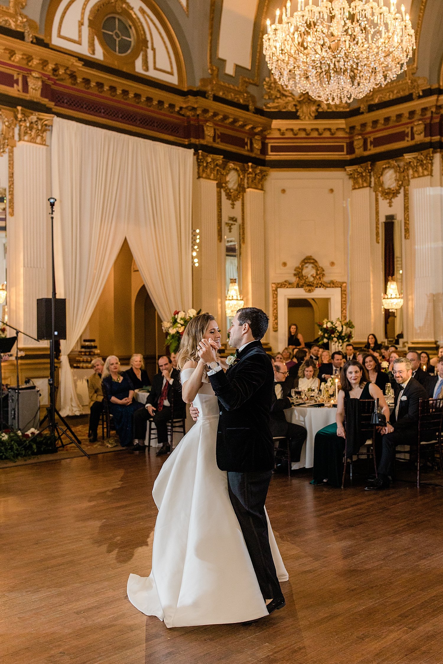 man and woman share first dance in the ballroom at The Belvedere