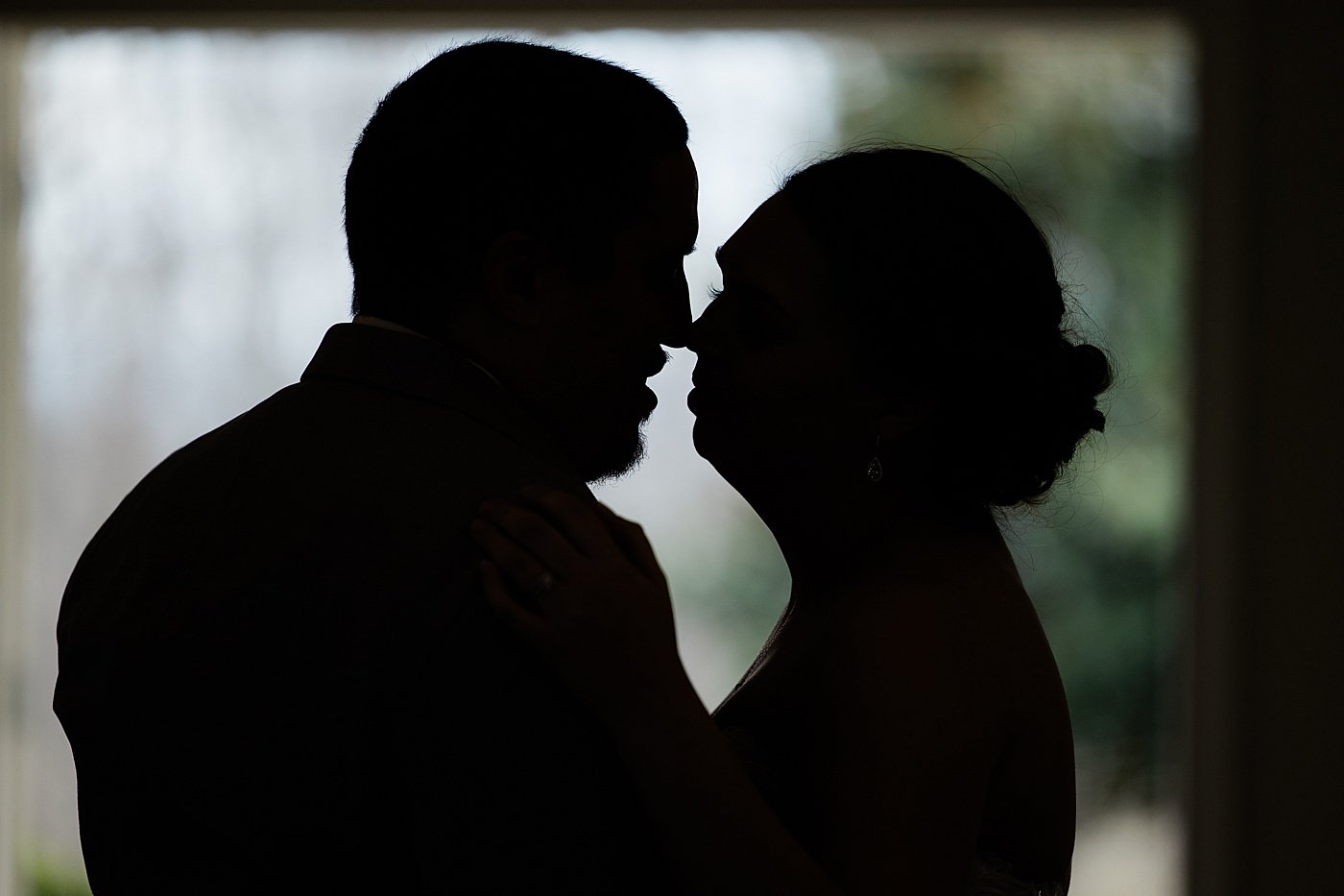 Silhouette photo of bride and groom dancing