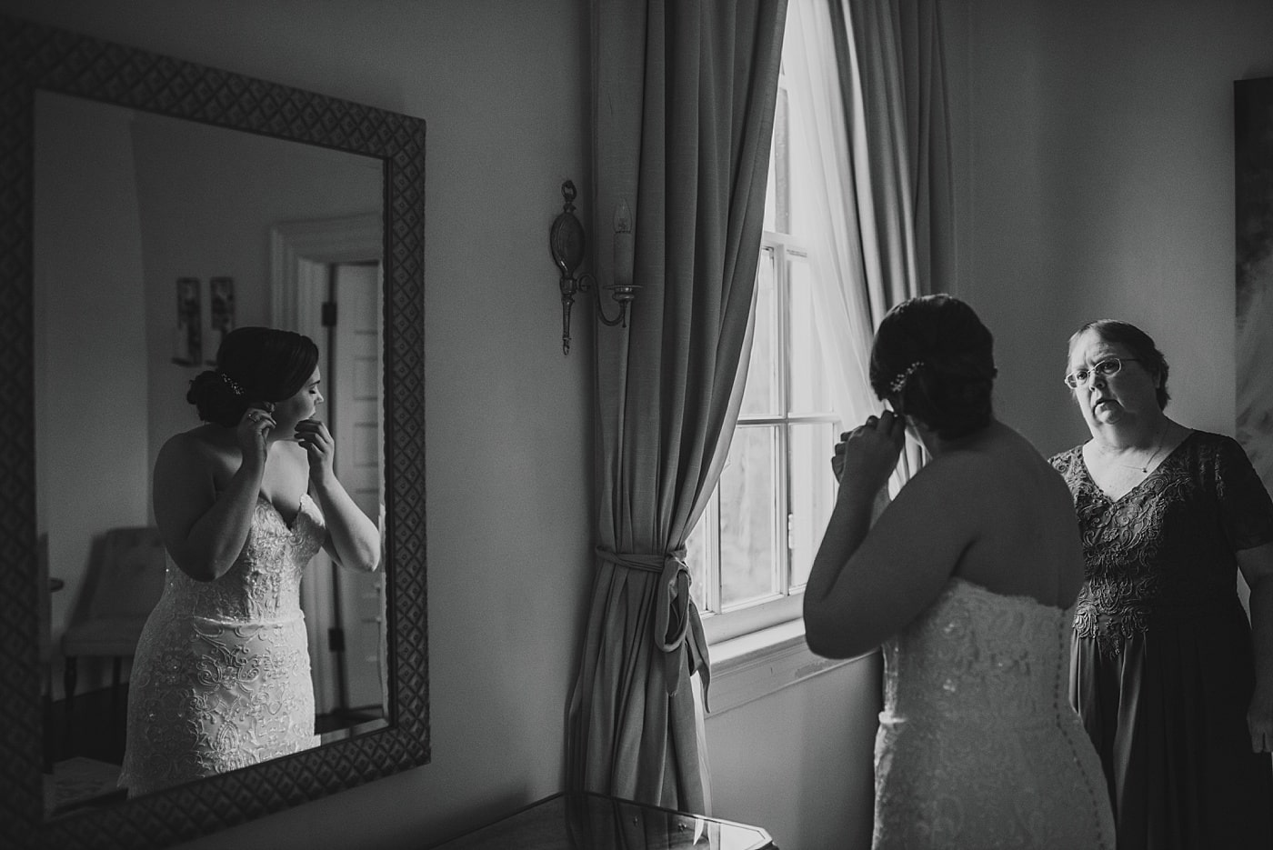 Bride getting ready on wedding day at Rust Manor House